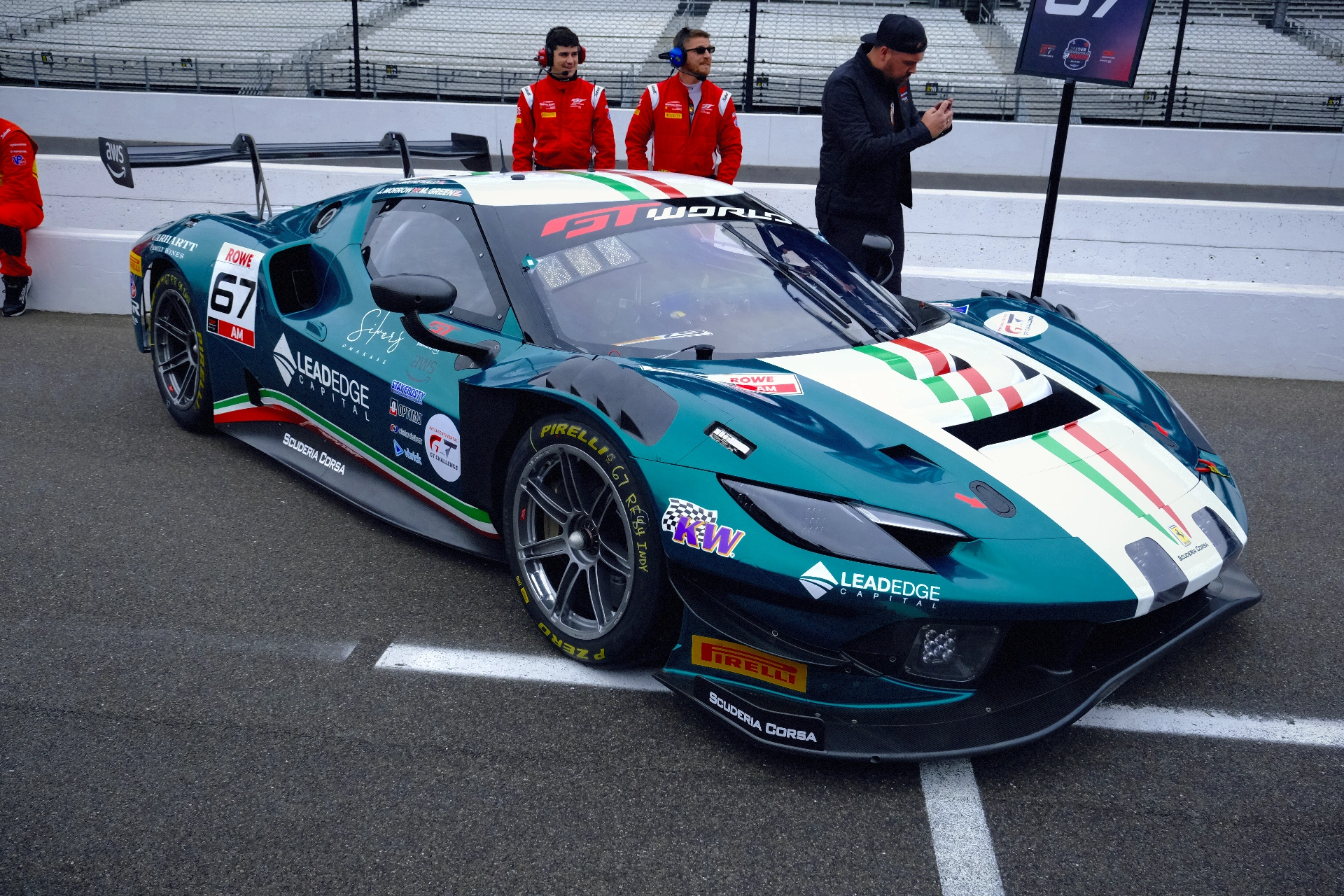 A teal racing car with cool tones and crisp photographic detail