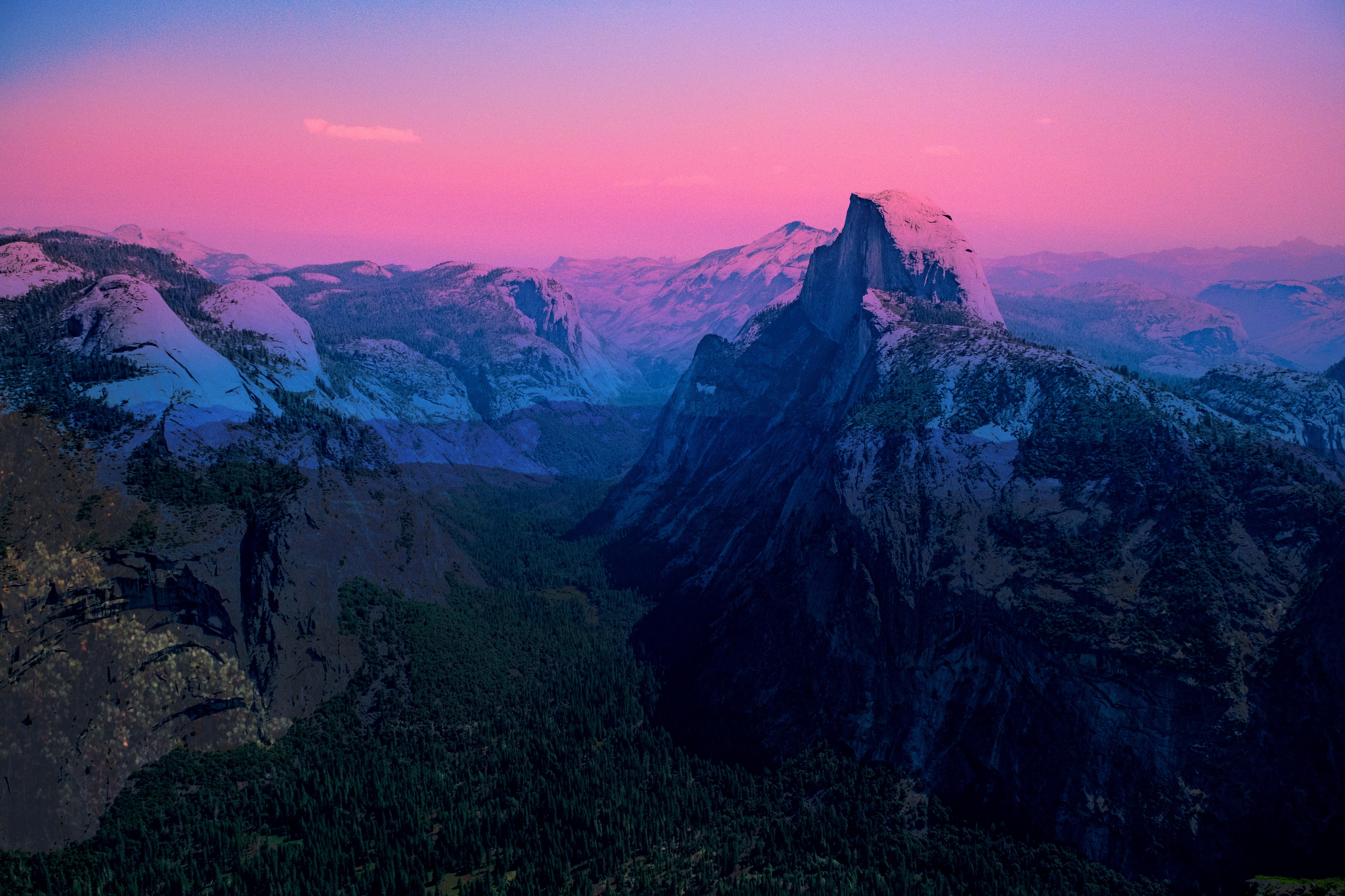 Yosemite’s Half Dome blended with a pink sky and deep blue tones